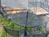 Patio table and five chairs three of one type of