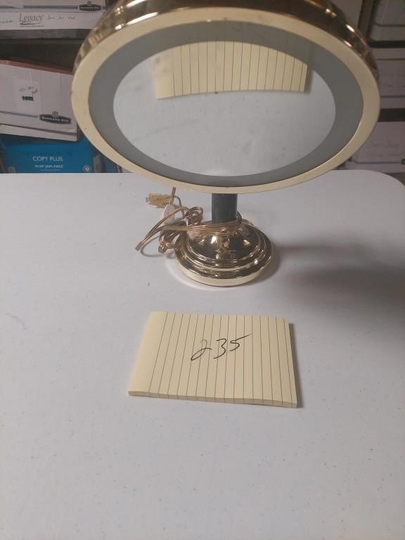 Electric lighted makeup mirror