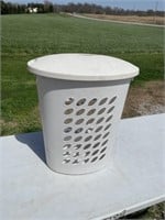 Plastic laundry basket with lid