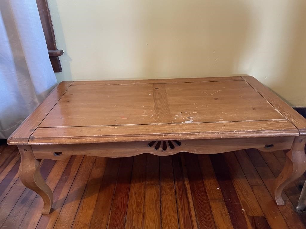 Large wooden coffee table does have scratches