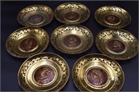 Set of six round brass plates of composer,