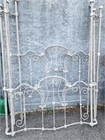 Queen size ornate iron poster bed with rails and