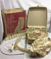 F9)  Vintage lady Sunbeam hair dryer, and manicure