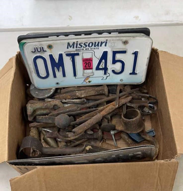 box of old tools, license plate etc