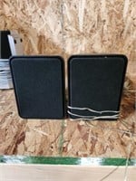 Unknown make/model bookshelf-style speakers.