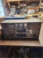 Small shop organizing cabinet filled with small