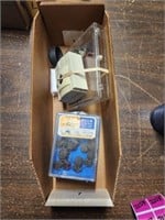 Box of assorted electronic parts including orange