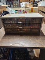 Small shop organizing cabinet filled with