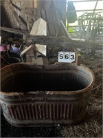 TWO WOODEN SADDLE STANDS, GALVANIZED TROUGH,