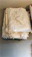 stack of doilies, blankets etc