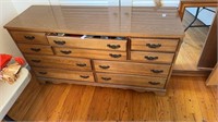Dresser with mirror, single bed (in basement)