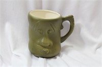 A Mid Century Modern Face Cup