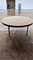 Six foot round plastic table (damaged top)