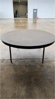 Six foot round plastic table (some damage)