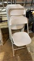 10 white plastic and metal event chairs