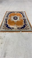 Wool rug hand woven in India 6’ by 9’