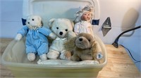 Teddy bears and doll in tub