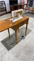 Singer sewing machine in stand, untested