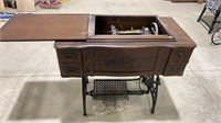 White sewing machine in stand