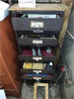 Tall metal filing 16 drawer with contents full.