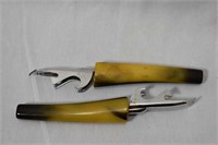 A Pair of Lucite/Bakelite Handle Can Openers