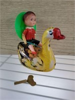 KEWPIE AND GOOSE WIND UP TIN TOY
