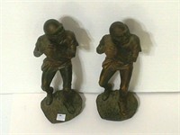 2 football Player Statues