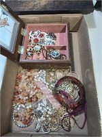 Flat with costume jewelry including a jewelry b