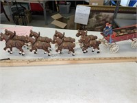 Cast-iron wagon with eight horses, looks like it