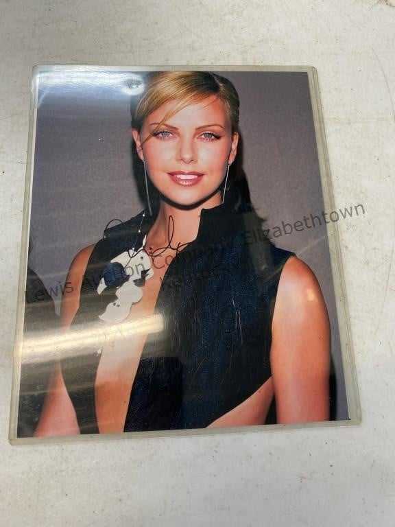 Autographed 8 x 10 of Charlize Theron has COA not