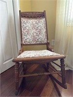 Wooden rocking chair with floral print