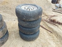 (4) 235/75R 15 tires w/Chevy 5 bolt rims