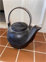 Small cast-iron kettle no markings but it's heavy