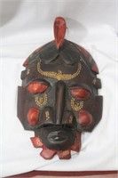 A Wooden Mask Form Wall Hanger