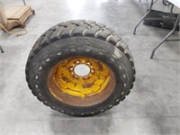 10 - 16.5 Skid loader rim and tire