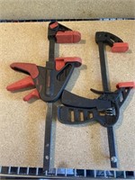 Two quick release ratcheting table clamps.    Bin