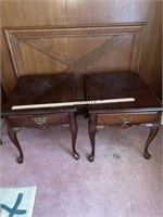 Two wooden end tables with drawers they open and