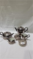 Silver plate over porcelain tea set