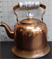 Vintage copper tea pot with ceramic handle