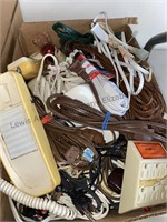 Box of extension cords, telephone and more