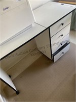 Small desk on rollers with 4 drawers