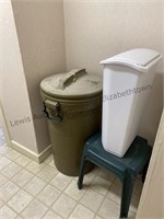 Garbage, cans and two green stools