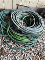 Stack of garden, hose unknown length, unknown