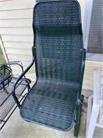 Green porch chair appears to be metal and plastic