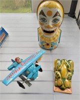 CLICKER AND AIRPLANE WIND UP TIN TOY