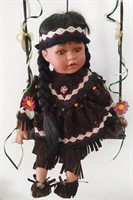Very Sweet Native Doll On Swing