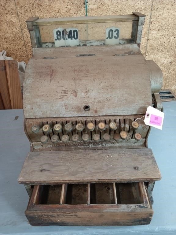 Antique cash register with wooden drawer