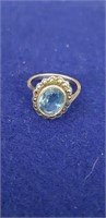 Sterling silver ring with blue stone, size 6 note