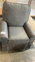 Swivel seat with rolled arms.