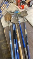 (Q) 6 USED LONG HANDLE TOOLS, 4 shovels, 2 racks